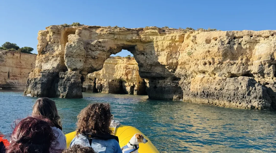 Otter Tours guests inside a sea cave during a guided boat tour in the Algarve, observing rock formations