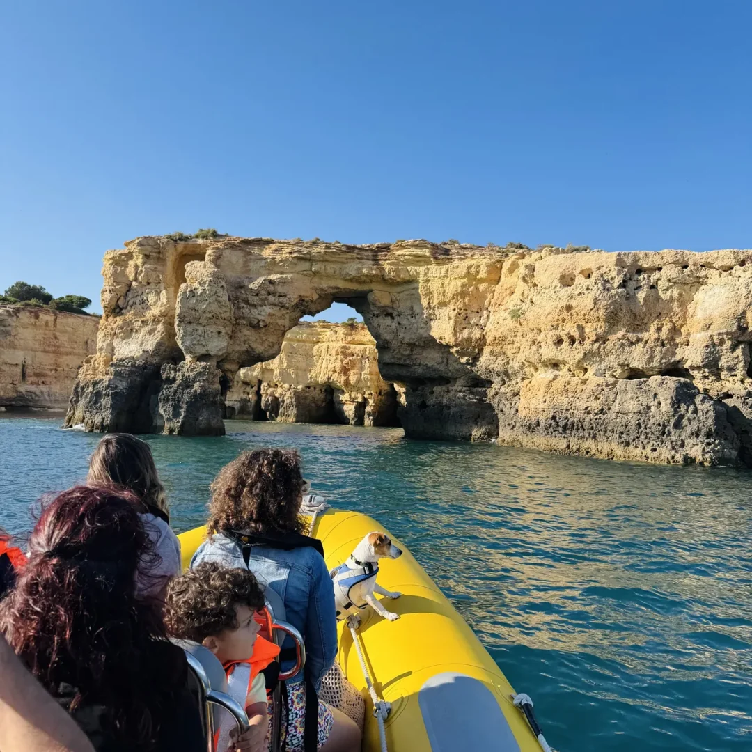 Otter Tours guests inside a sea cave during a guided boat tour in the Algarve, observing rock formations