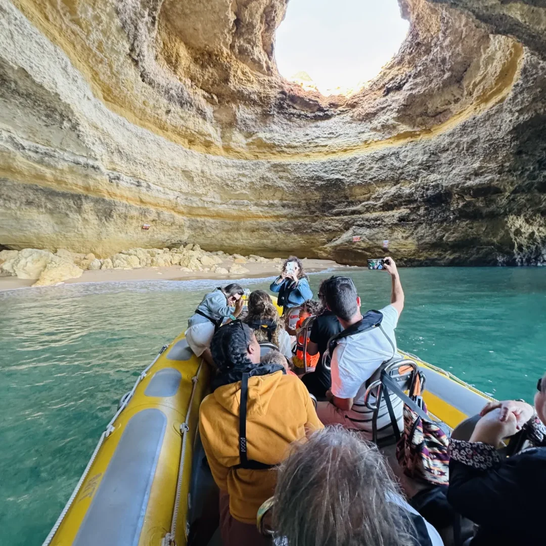 Otter Tours guides delivering a cave interpretation session during a boat tour in the Algarve