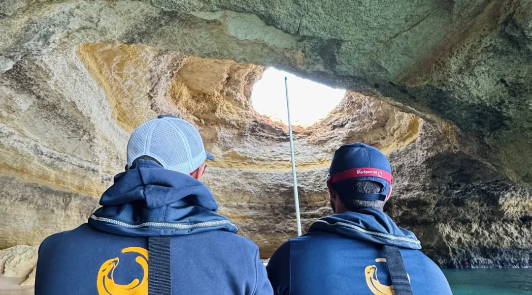 Otter Tours marine guides interpreting a sea cave during an eco-friendly boat tour in the Algarve