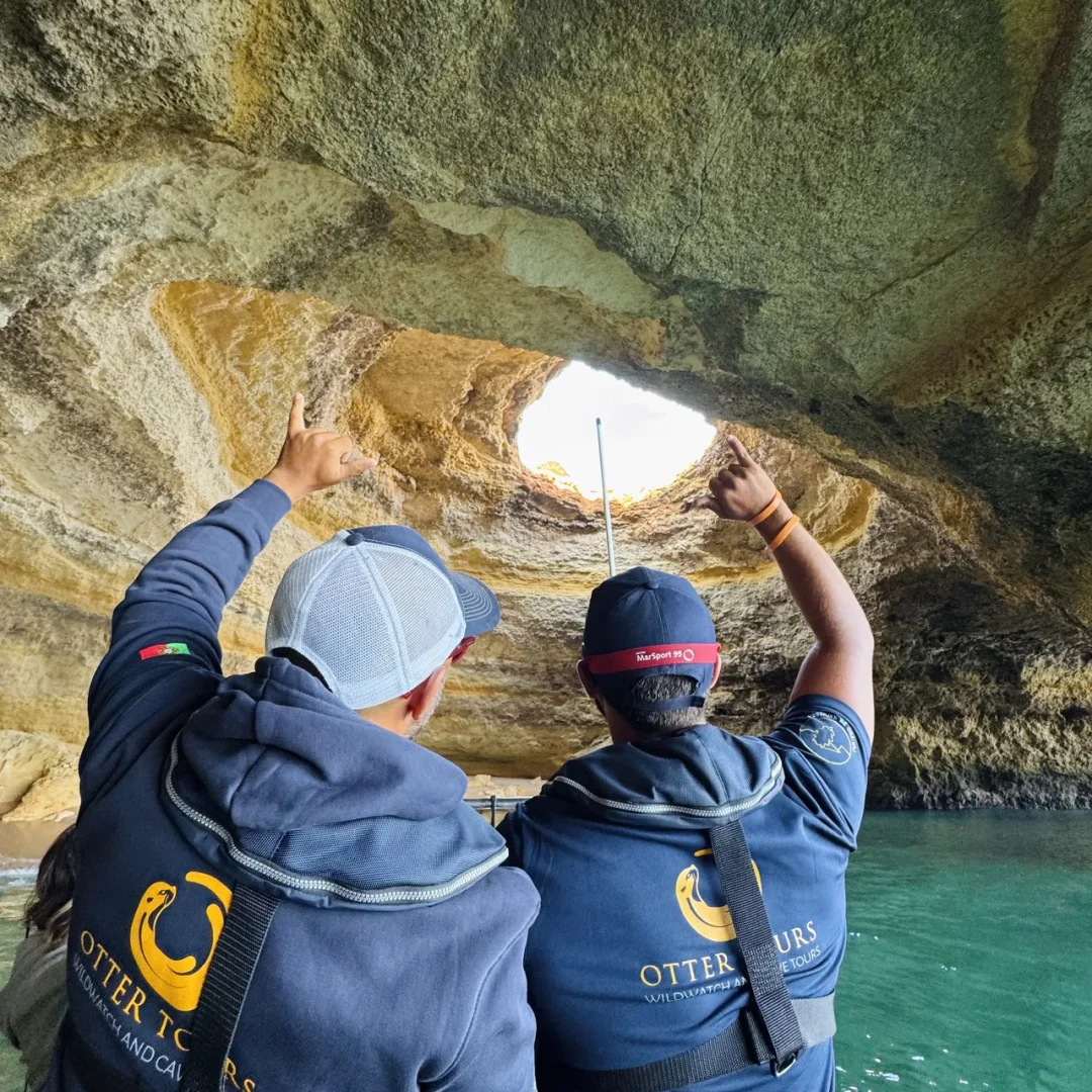 Otter Tours guides providing environmental interpretation inside a sea cave during a boat tour